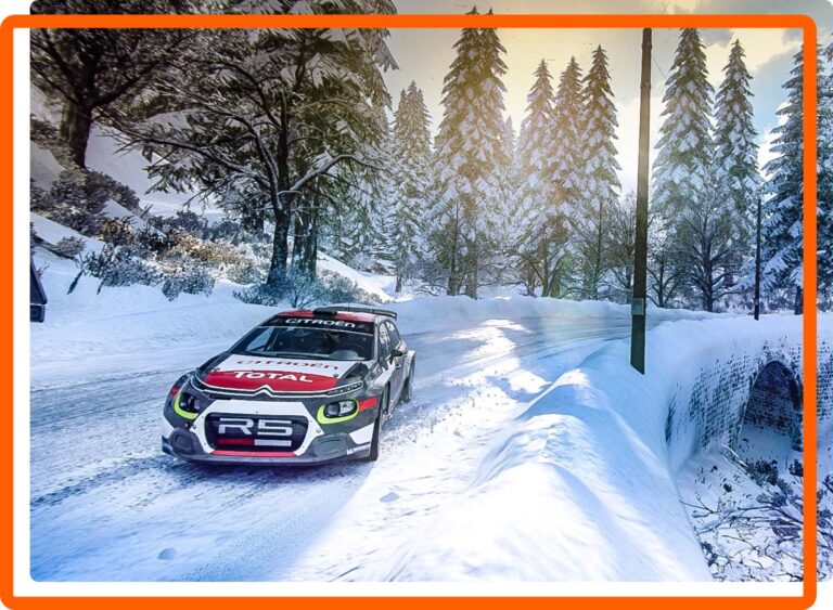 rally car racing through snow and pine trees